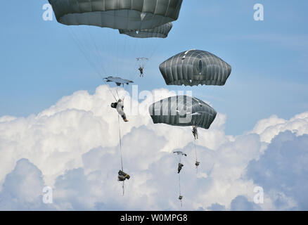 Paratroopers assigned to the 4th Infantry Brigade Combat Team (Airborne), 25th Infantry Division, U.S. Army Alaska, execute an airborne proficiency operation at Joint Base Elmendorf-Richardson, Alaska, June 9, 2016, during Exercise Arctic Aurora. Arctic Aurora is a yearly bilateral training exercise involving elements of the Spartan Brigade and the Japan Ground Self-Defense Force, which focuses on strengthening ties between the two by executing combined small unit airborne proficiency operations and basic small arms marksmanship. Photo by Justin Connaher/U.S. Air Force/UPI Stock Photo