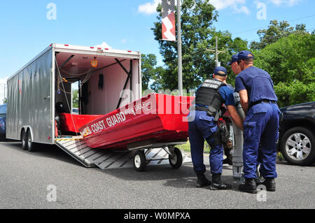 Coast Guard members assigned to Sector Lower Mississippi River offload a boat to search for people displaced by local flooding in St. Amant, La., on August 16, 2016. To date, Coast Guard crews have rescued more than 219 people, assisted more than 3,000 people in distress and rescued 57 pets. Photo by Melissa Leake/U.S. Coast Guard/UPI Stock Photo