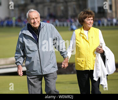 Arnold Palmer (L) seen with his wife Kathleen Gawthrop in this July 15, 2015 file photo from the the144th Open Championship at St.Andrews, died today, September 25, 2016, at 87 according to a USGA statement. The seven-time major winner was known as the king of golf and given credit for bringing the sport to the masses. File Photo by Hugo Philpott/UPI Stock Photo