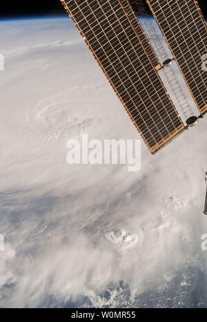 The International Space Station has tracked Hurricane Matthew all week, providing images and video from low Earth orbit as the storm hit the Caribbean Sea and made its way towards Florida. In this photograph taken by Expedition 49 Flight Engineer Kate Rubins on October 4, 2016, the hurricane's clouds extend across the frame and the space station's solar arrays are visible at the upper-right corner of the image. NASA/UPI Stock Photo