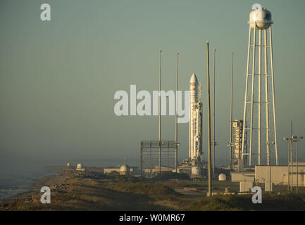 The Orbital ATK Antares rocket, with the Cygnus spacecraft onboard, is seen on launch Pad-0A during sunrise, Sunday, Oct. 16, 2016 at NASA's Wallops Flight Facility in Virginia. Orbital ATK’s sixth contracted cargo resupply mission with NASA to the International Space Station will deliver over 5,100 pounds of science and research, crew supplies and vehicle hardware to the orbital laboratory and its crew. Nasa Photo by Bill Ingalls/UPI