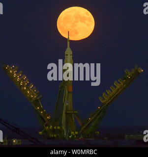 The moon, or supermoon, is seen rising behind the Soyuz rocket at the Baikonur Cosmodrome launch pad in Kazakhstan, on Monday, November 14, 2016. NASA astronaut Peggy Whitson, Russian cosmonaut Oleg Novitskiy of Roscosmos, and ESA astronaut Thomas Pesquet will launch from the Baikonur Cosmodrome in Kazakhstan the morning of November 18 (Kazakh time). All three will spend approximately six months on the orbital complex.  A supermoon occurs when the moon's orbit is closest (perigee) to Earth. NASA Photo by Bill Ingalls/UPI Stock Photo
