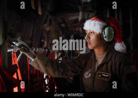 Airman 1st Class Alejandra Vargas, 36th Airlift Squadron C-130 Hercules loadmaster, performs preflight inspections during Operation Christmas Drop at Andersen Air Force Base, Guam, December 5, 2016. Operation Christmas Drop is a training mission which helps the 374th Airlift Wing, Yokota AB, Japan, along with Japan Air Self-Defense Force and Royal Australian Air Force, to maintain and develop combat readiness through sustainable aircraft generation/recovery while practicing low-cost, low-altitude airdrops. Photo by Delano Scott/U.S. Air Force/UPI Stock Photo