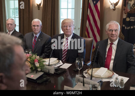 US President Donald J. Trump (C) sits with members of his administration; US Defense Secretary James Mattis (L), US Vice President Mike Pence (2-L) and Secretary of State Rex Tillerson (R) during a luncheon with President of Turkey Recep Tayyip Erdogan (not pictured) and members of the Turkish delegation, in the Cabinet Room of the White House in Washington, DC on May 16, 2017. Trump and Erdogan face the issue of working out cooperation in the fight against terrorism as Turkey objects to the US arming of Kurdish forces in Syria.     Photo by Michael Reynolds/UPI Stock Photo