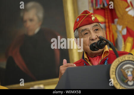 Navajo code talker Peter MacDonald speaks during an event hosted by President Donald Trump honoring the Native American code talkers in the Oval Office of the White House in Washington, DC on November 27, 2017.  The Code Talkers used their native language to protect battlefield communications for American troops in World War II.     Photo by Oliver Contreras/UPI Stock Photo