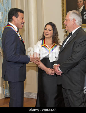 Lionel Richie and Gloria Estefan two of the five recipients of the 40th Annual Kennedy Center Honors talk with Secretary of State Rex Tillerson before posing for a group photo following a dinner hosted by United States Secretary of State Rex Tillerson in their honor at the US Department of State in Washington, D.C. on Saturday, December 2, 2017.  From left to right back row: LL Cool J and Lionel Richie  Front row, left to right: Carmen de Lavallade, Norman Lear and Gloria Estefan.  The 2017 honorees are: American dancer and choreographer Carmen de Lavallade; Cuban American singer-songwriter an Stock Photo