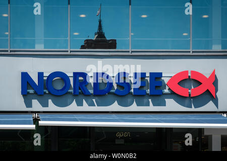 Berlin, Germany - June, 2019: Nordsee brand logo on store facade in Berlin. Nordsee is a German fast-food restaurant chain specialising in seafood Stock Photo