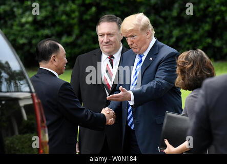 US President Donald Trump shakes hands with  Kim Yong Chol, former North Korean military intelligence chief and one of leader Kim Jong Un's closest aides, as Secretary of State Mike Pompeo looks on  outside the  Oval Office of the White House in Washington on Friday, June 1, 2018. Photo by Olivier Douliery/UPI Stock Photo