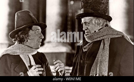 SCROOGE 1951 United Artists film with Alastair Sim at right and Mervyn Johns Stock Photo