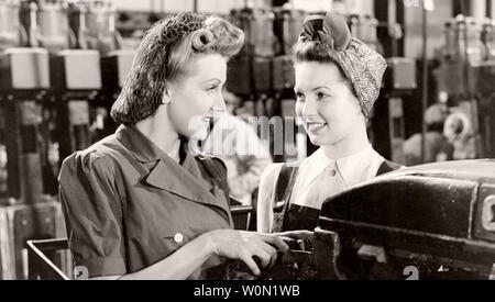 MILLIONS LIKE US 1943 Gainsbrough Pictures film with Anne Crawford at left and Patricia Roc in an aircraft factory Stock Photo