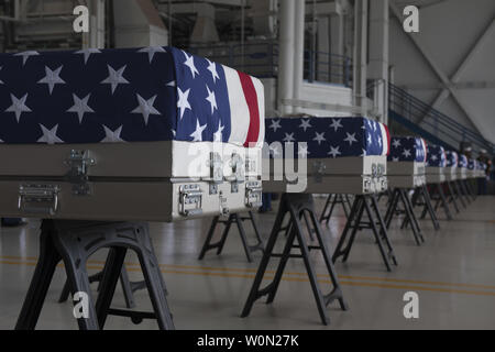 Transfer cases, containing the remains of what are believed to be U.S. service members lost in the Korean War, line the bay of a hangar at the end of an honorable carry ceremony at Joint Base Pearl Harbor-Hickam (JBPH-H), Hawaii, on August 1, 2018. The ceremony marked the arrival of 55 transfer cases recently repatriated from North Korea. The Defense POW/MIA Accounting Agency will receive the remains to start the identification process. Photo by Staff Sgt. Mikaley Kline/U.S. Air Force/UPI Stock Photo