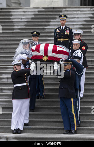 Joint service members of a military casket team carry the casket of Senator John McCain from the US Capitol to a motorcade that will ferry him to a funeral service at the National Cathedral in Washington, DC,  September 1, 2018. McCain died August 25, 2018 from brain cancer at his ranch in Sedona, Arizona, USA. He was a veteran of the Vietnam War, served two terms in the US House of Representatives, and was elected to five terms in the US Senate. McCain also ran for president twice, and was the Republican nominee in 2008.       Photo by Jim Lo Scalzo/UPI Stock Photo