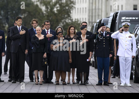 Members of the McCain family watch joint service members of a military casket team carry the casket of Senator John McCain from the US Capitol to a motorcade that will ferry him to a funeral service at the National Cathedral in Washingto, DC, on September 1, 2018. McCain died August 25, 2018 from brain cancer at his ranch in Sedona, Arizona, USA. He was a veteran of the Vietnam War, served two terms in the US House of Representatives, and was elected to five terms in the US Senate. McCain also ran for president twice, and was the Republican nominee in 2008.   Photo by Jim Lo Scalzo Stock Photo