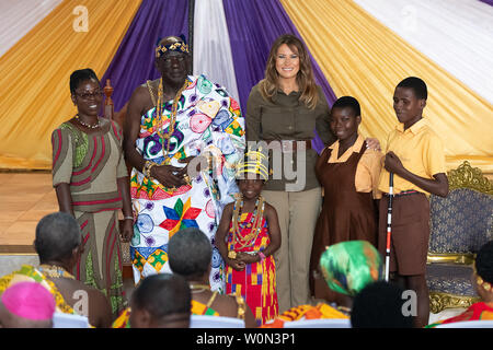 First Lady Melania Trump poses for photos with the Cape Coast's Paramount Chief, Osabarimba Kwesi Atta II, chieftains and guests on October 3, 2018, at the Emintsimadze Palace in Cape Coast, Ghana. The first lady is embarking on her first big solo international trip, a five-day, four-country tour of Africa where she will focus on child well-being. White House Photo by Andrea Hanks/UPI Stock Photo