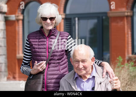 Edinburgh, Lothian / Scotland - June 22nd 2019: Senior old couple portrait in city waiting for the festival Stock Photo