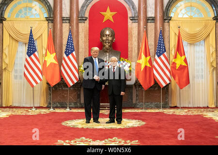 U.S. President Donald Trump (L) shakes hands with Vietnamese President Nguyen Phu Trong (R) during their meeting on February 27, 2019, ahead of the US-North Korea summit in Hanoi, Vietnam. The two leaders presided over the signing of several commercial trade deals including those between Boeing and Vietnam's Bamboo Airways and VietJet Aviation JSC worth $15.7 billion. The president is in Hanoi for his second summit with North Korean leader Kim Jong Un where they will discuss the denuclearization of the Korean peninsula. Photo via The White House/UPI Stock Photo