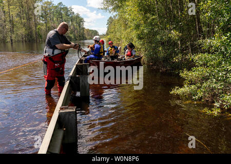 Members of the Humane Society of Missouri, rescue three rooster two hens following Hurricane Florence, now tropical depression September 18, 2018 in Currie, North Carolina. Florence, is continuing to dump rain on North and South Carolina and the Cape Fear River Valley and other rivers will rise breaking record flood levels.     Photo by Ken Cedeno/UPI Stock Photo