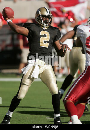 New Orleans Saints quarterback Aaron Brooks is chased out of the