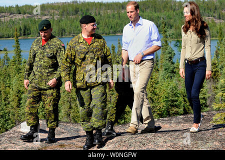 Prince William and his wife Kate, the Duke and Duchess of Cambridge walk with Canadian Rangers at Blachford Lake during their royal tour to Yellowknife, North West Territories, July 5, 2011.    UPI/hr/Courtesy Heritage Canada Stock Photo