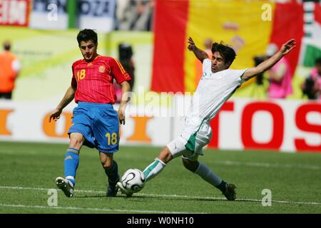 Spain's Cesc Fabregas and Saudi Arabia's Hussein Sulimani during the final Group H match of the FIFA World Cup Germany 2006 in Kaiserslautern, Germany on June 23, 2006. Spain advanced to the round of 16 as they beat Saudi Arabia 1-0. Juanito's goal off his head in the 36th-minute  confirmed the Saudi elimination after one draw and two defeats. (UPI  Photo/Christian Brunskill) Stock Photo