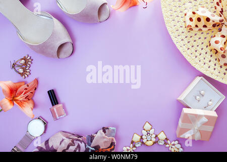 Summer female outfit. Set of clothes, shoes, cosmetics and accessories with fresh flowers. Beauty fashion concept. Trendy jewellery. Copy space Stock Photo