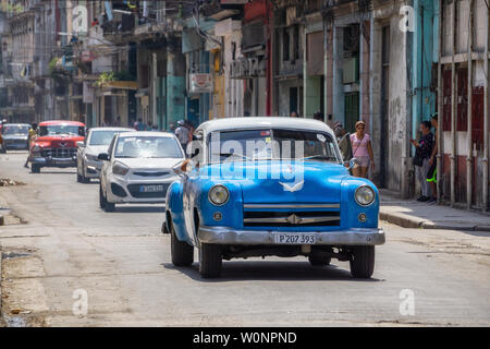 Havana, Cuba - May 16, 2019: Classic Old Taxi Car in the street during a vibrant and bright sunny day. Stock Photo