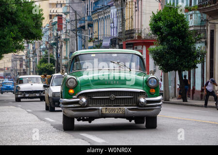 Havana, Cuba - May 16, 2019: Classic Old Taxi Car in the street during a vibrant and bright sunny day. Stock Photo