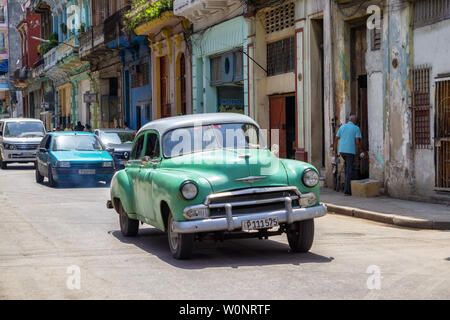 Havana, Cuba - May 16, 2019: Classic Old Taxi Car in the street during a vibrant and bright sunny day. Stock Photo