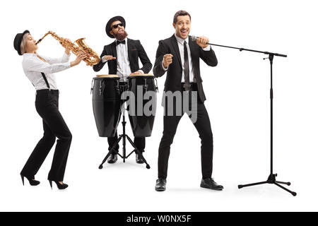 Full length shot of a band playing on a sax and conga drums and a singer singing on a microphone isolated on white background Stock Photo