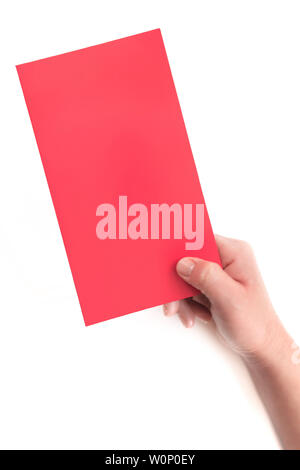 A hand holding a red envelope (red card) close-up on a white background Stock Photo