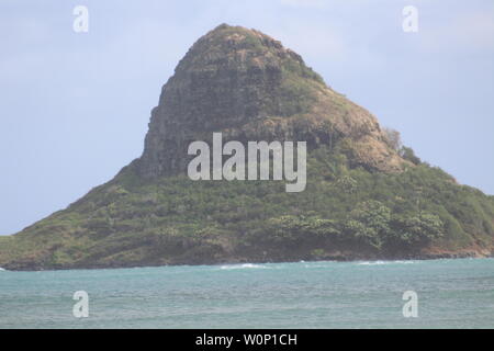 Mokoli'i Island (previously known as the outdated term 'Chinaman's Hat') on eastern shore of Oahu in Hawaii. Stock Photo