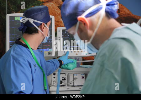 doctors and nurses preforming surgery Stock Photo