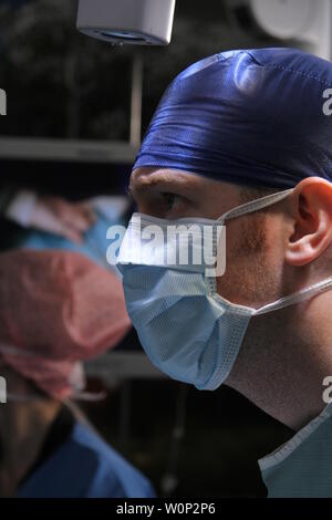 doctors and nurses preforming surgery Stock Photo