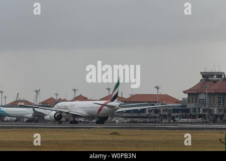 DENPASAR,BALI/INDONESIA-JUNE 08 2019: The Fly Emirates Airline Aeroplane prepares for taxiing, after landing at Ngurah Rai Airport Bali Stock Photo