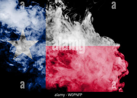 The national flag of the US state Texas in against a gray smoke on the day of independence in different colors of blue red and yellow. Political and r Stock Photo