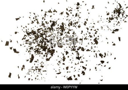 Closeup of black burnt paper ash dispersed on white background Stock Photo