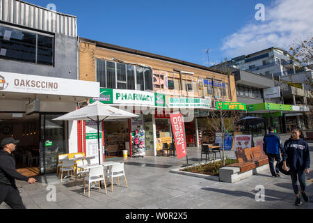 Dee Why, suburb of Sydney with high street shops and pharmacy on Oaks Avenue,Sydney,Australia Stock Photo