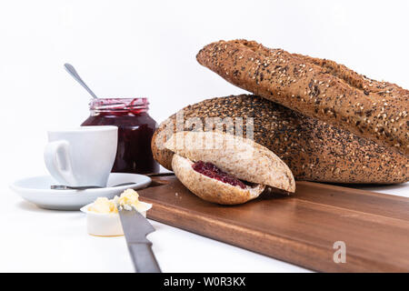 two small pieces of bread with jam. Raspberry jam and espresso coffee Stock Photo