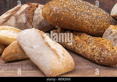 Assortment of baked bread on table background. food concept Stock Photo