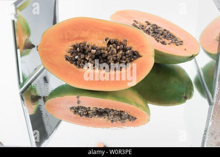 TWO pieces of sweet orange and one piece of Papaya isolated on white  background 9695160 Stock Photo at Vecteezy