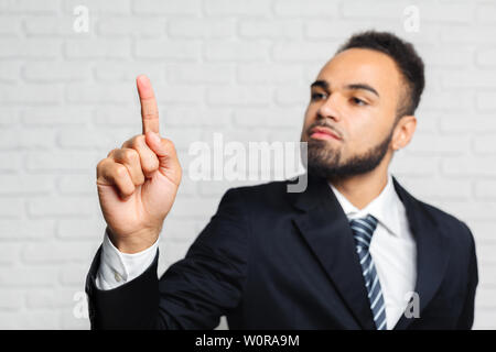 Business man touching an imaginary screen Stock Photo