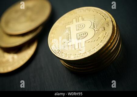 Bitcoins on a wood table. Stock Photo