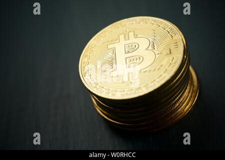 Bitcoins on a wood table. Stock Photo