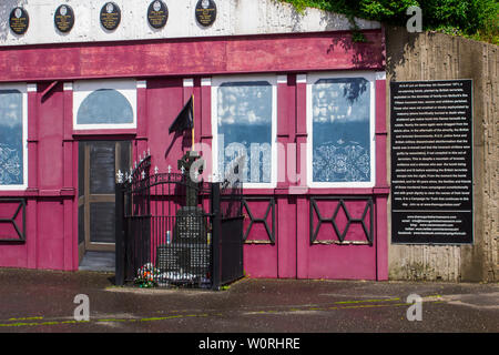 17 June 2019 The Memorial Facade and Celtic cross on the site of McGurk's Bar where 15 people were murdered in a bomb atrocity perpetrated by the UVF Stock Photo