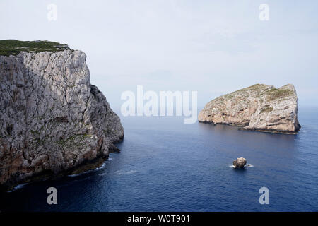 Capo Caccia, Foradada island. Imposing white limestone with rock 182 meters hight, in Sardinia/Sardegna, Italy Stock Photo