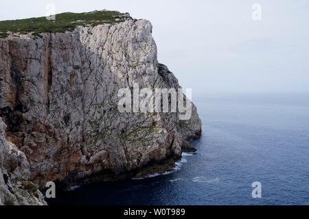 Capo Caccia, Foradada island. Imposing white limestone cliff, in Sardinia/Sardegna, Italy Stock Photo