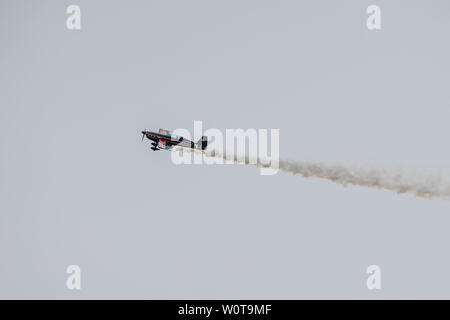 BERLIN, GERMANY - APRIL 27, 2018: Aerobatic monoplane Extra Flugzeugbau EA300S. Exhibition ILA Berlin Air Show 2018 Stock Photo