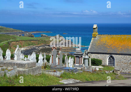 View of the coast near Porthmeor beach in St. Ives, Cornwall (UK) with the Barnoon cemetery and St. Nicholas chapel in the foreground. Stock Photo