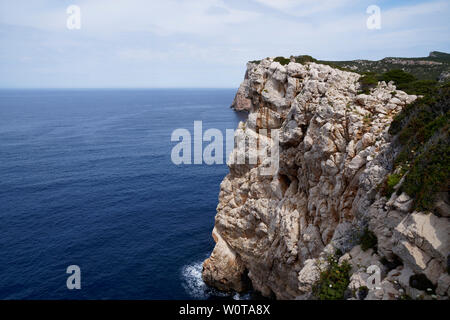 Capo Caccia, Foradada island. Imposing white limestone cliff, in Sardinia/Sardegna, Italy Stock Photo