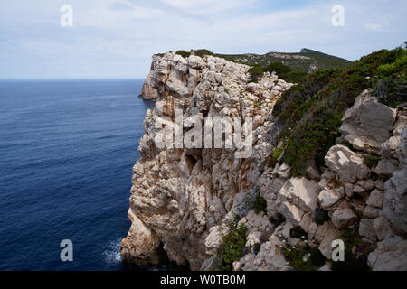 Capo Caccia, Foradada island. Imposing white limestone cliff, in Sardinia/Sardegna, Italy Stock Photo